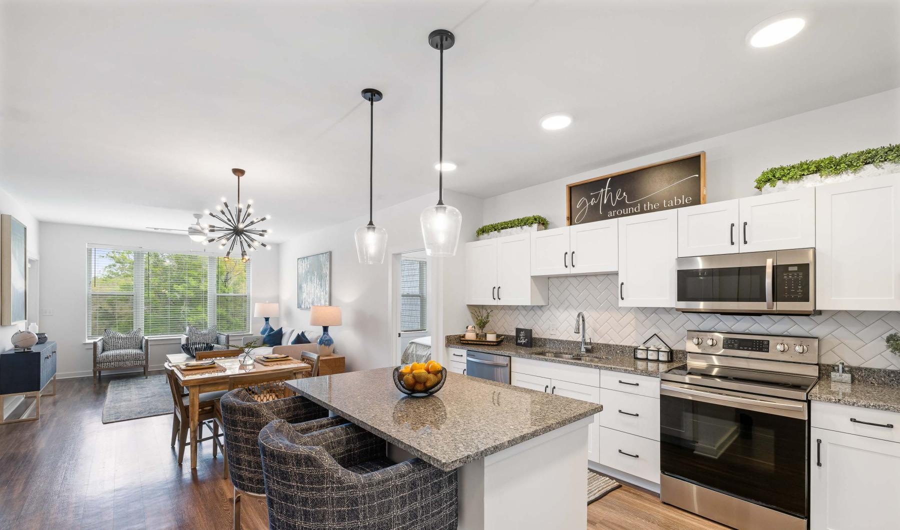 Beautiful living areas to match your lifestyle a kitchen with a table and chairs