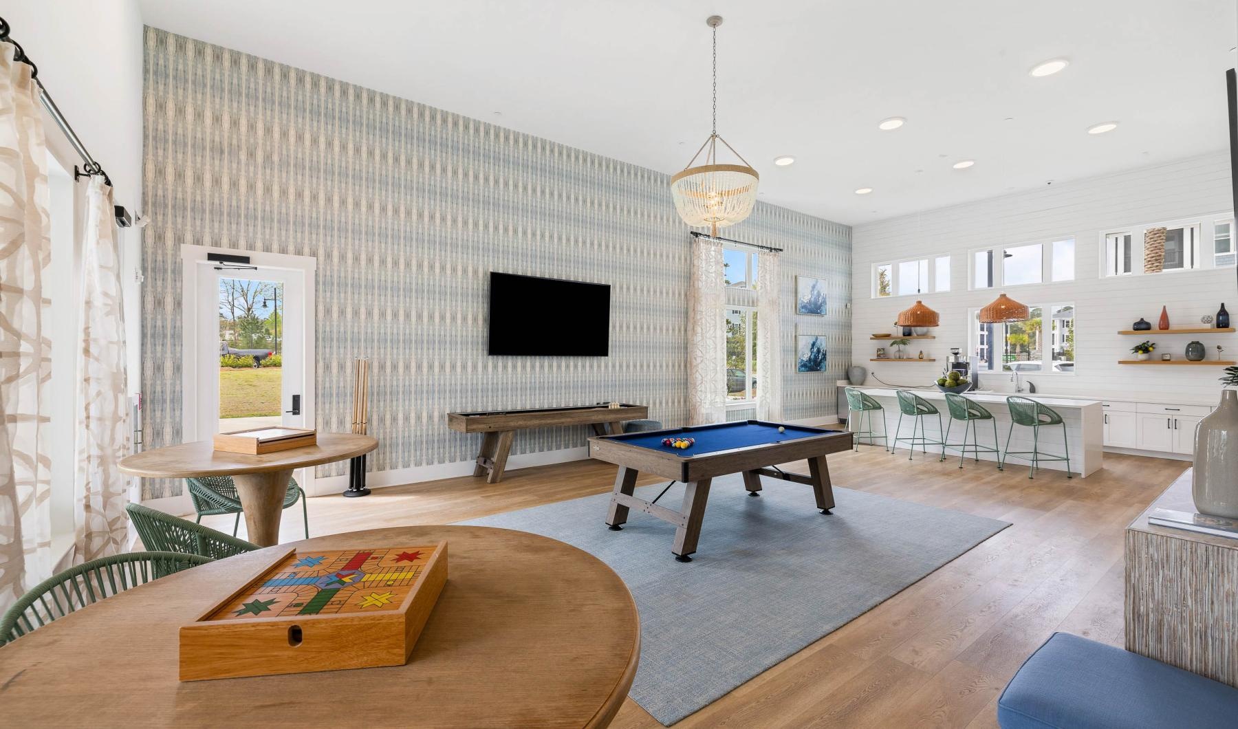 Enjoy our resident-only features a large living room with a tv and pool table