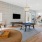 a large living room with a tv and pool table