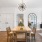 a dining room with a chandelier and a table